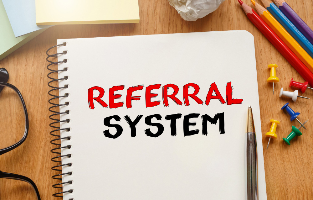 notebook with toolls notes about referral system